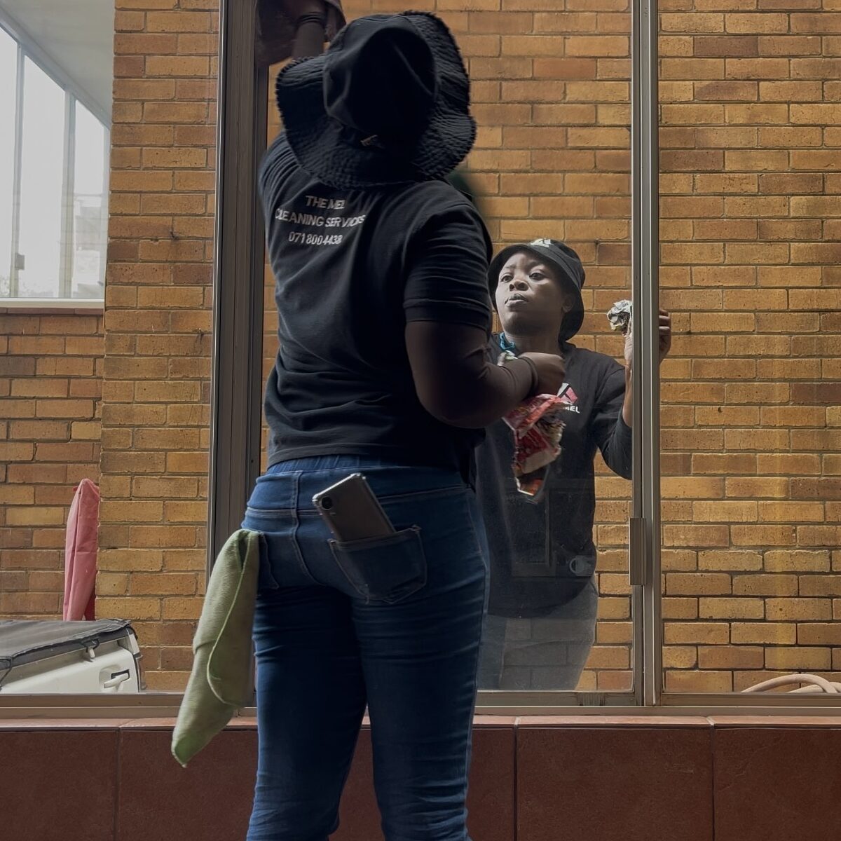 women cleaning windows